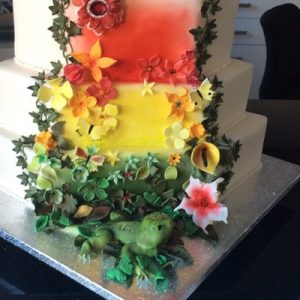 Rainforest inspired wedding cake bright colours red, green,yellow