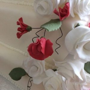 close up of white roses and sweet peas