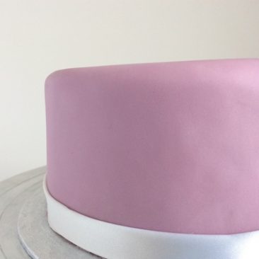 Close up of the side of a cake ,Matt purple icing
