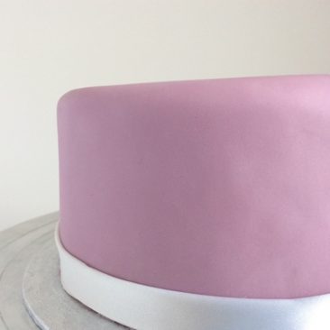 Close up of the side of a cake ,Matt purple icing