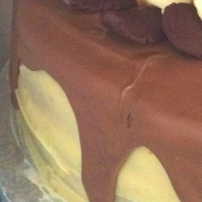 close up of white chocolate ganache and chocolate drips