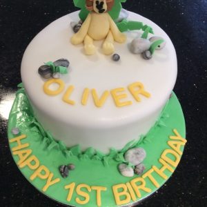 cute lion cake with name and happy 1st birthday