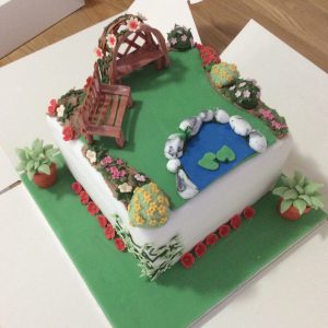garden cake with rose arch and bench